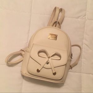 Beige backpack.